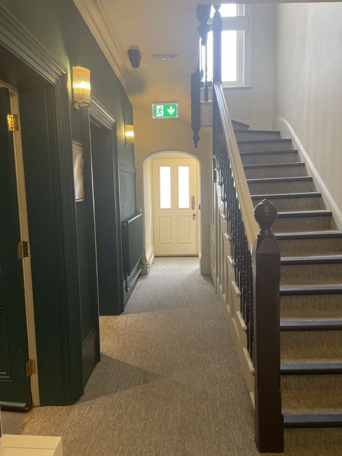 The hallway and original staircase inside the Floatwell villa in Cambridge