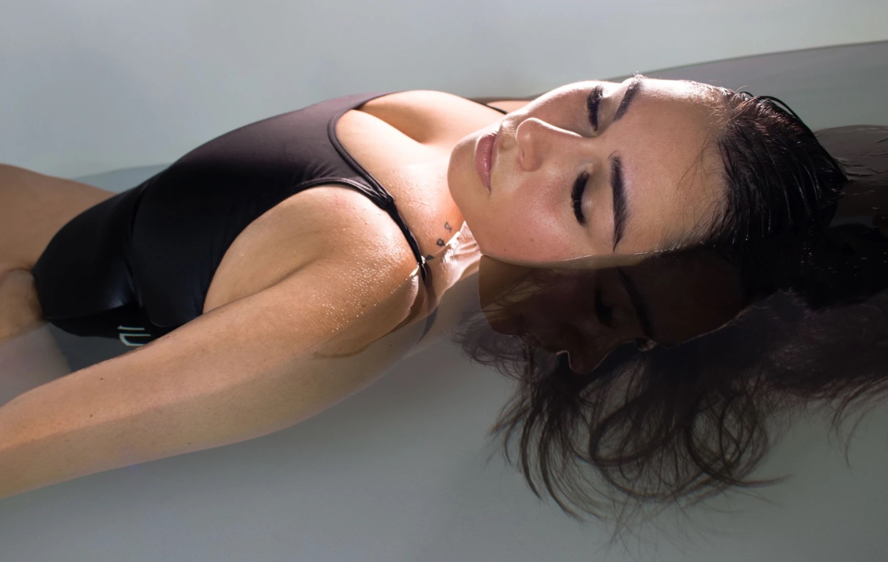 A floater resting at the surface of the Epsom-salt pod at Floatwell Cambridge