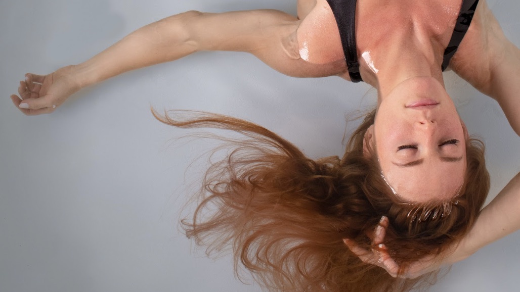 A guest floating with her eyes closed at Floatwell Cambridge