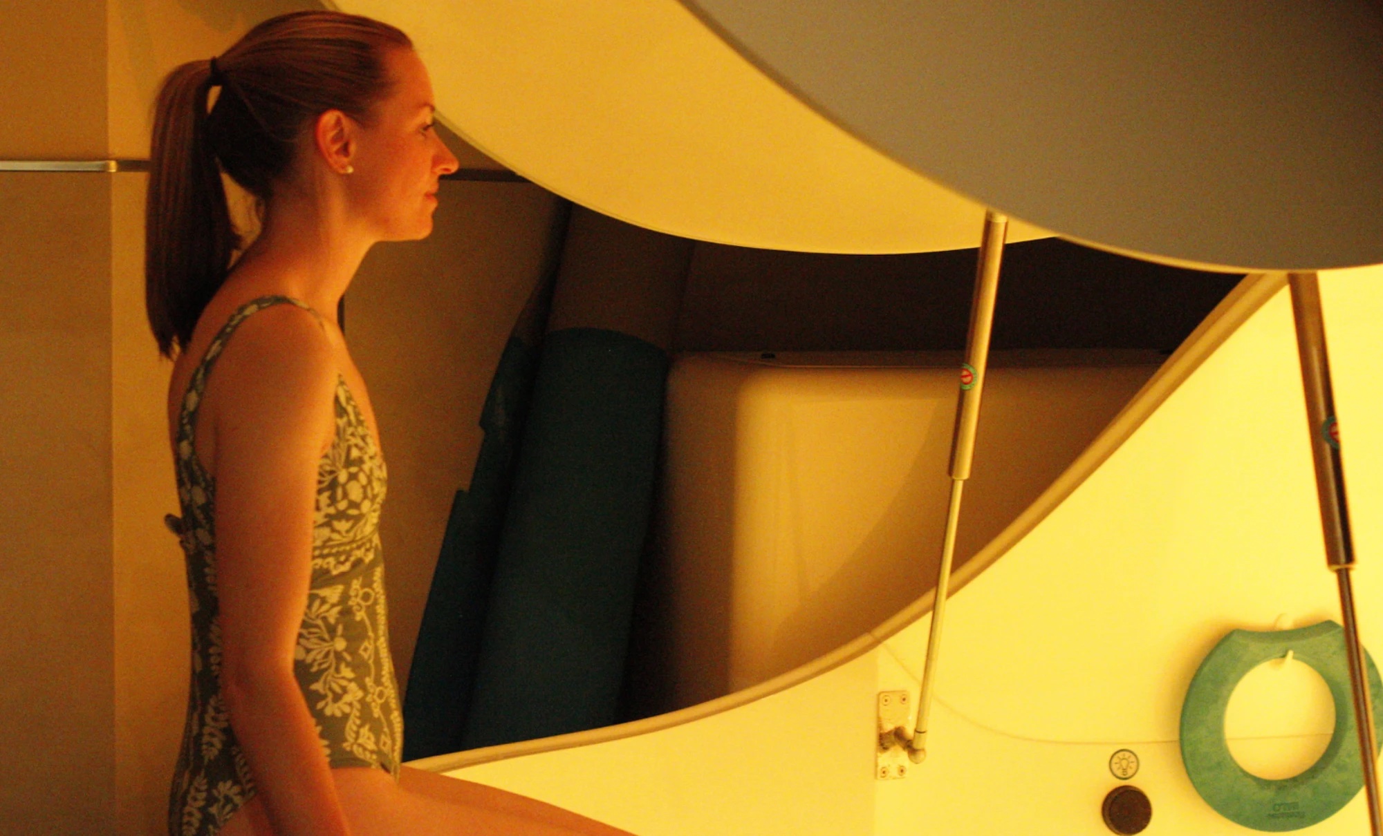 A member stepping into the floatation pod at Floatwell Cambridge