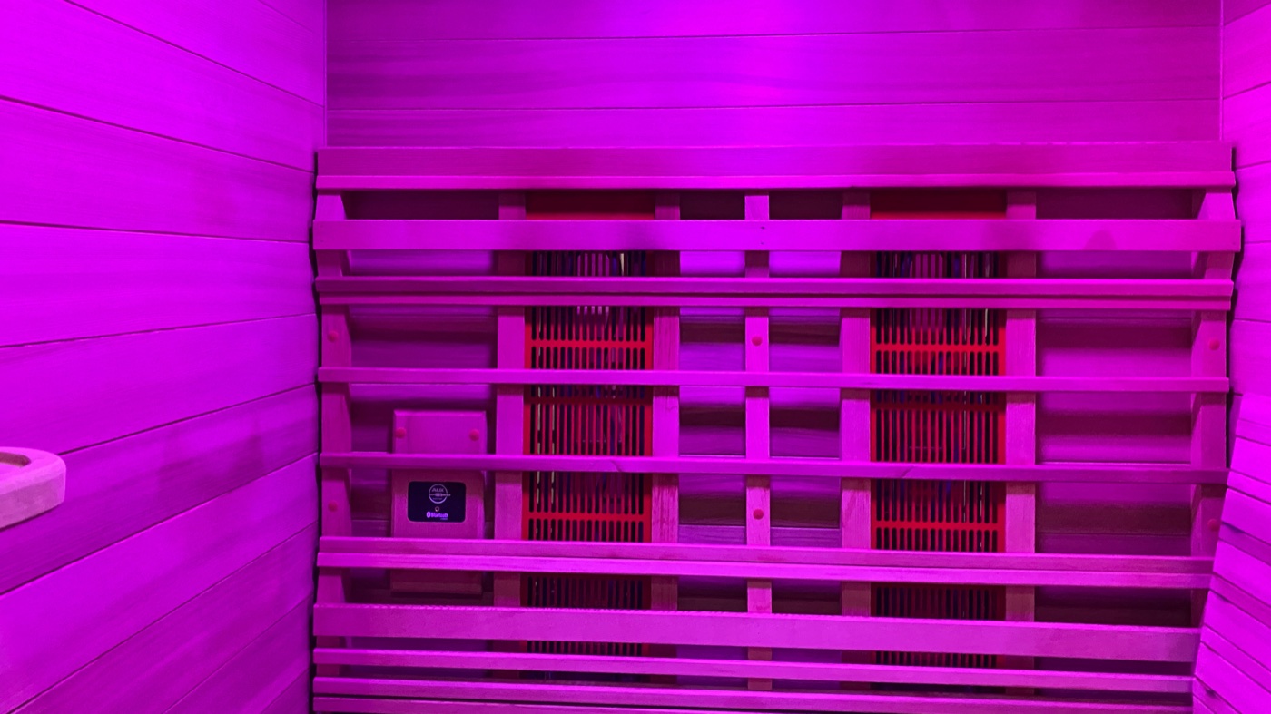 The full-spectrum infrared sauna at Floatwell Cambridge, lit with chromotherapy