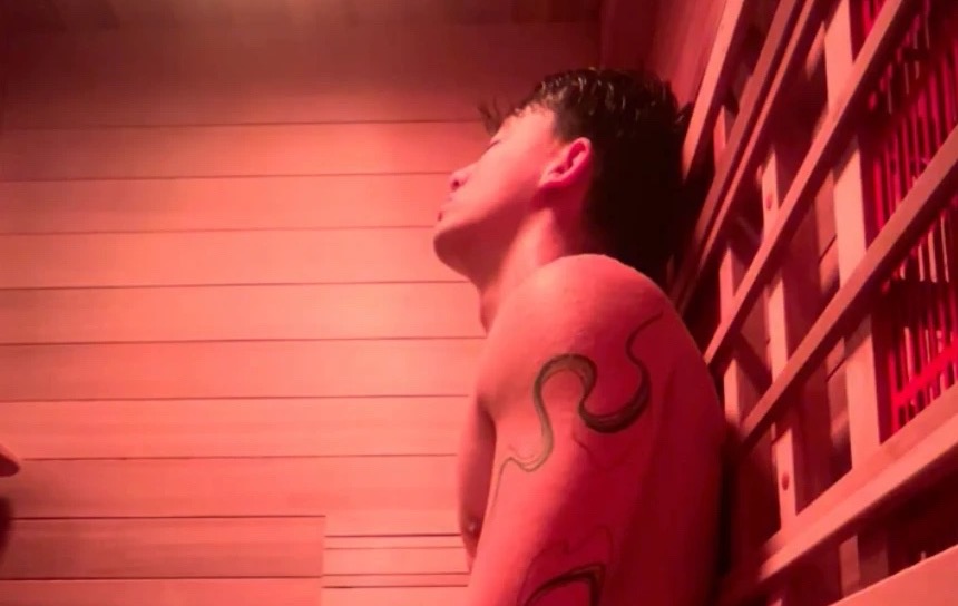 A guest in the full-spectrum infrared sauna at Floatwell Cambridge