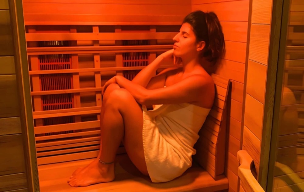 A guest in the full-spectrum infrared sauna at Floatwell Cambridge